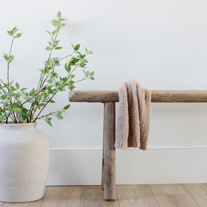 Beautiful home decor with plant, bench, and soft and cozy BAMBONI® MINI BLANKETS - Saranoniy