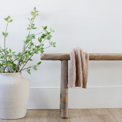 Beautiful home decor with plant, bench, and soft and cozy BAMBONI® MINI BLANKETS - Saranoniy