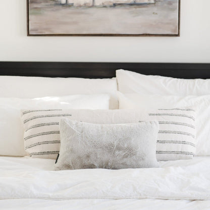 Saranoni Grand pillow cover in a modern living space with luxury blankets