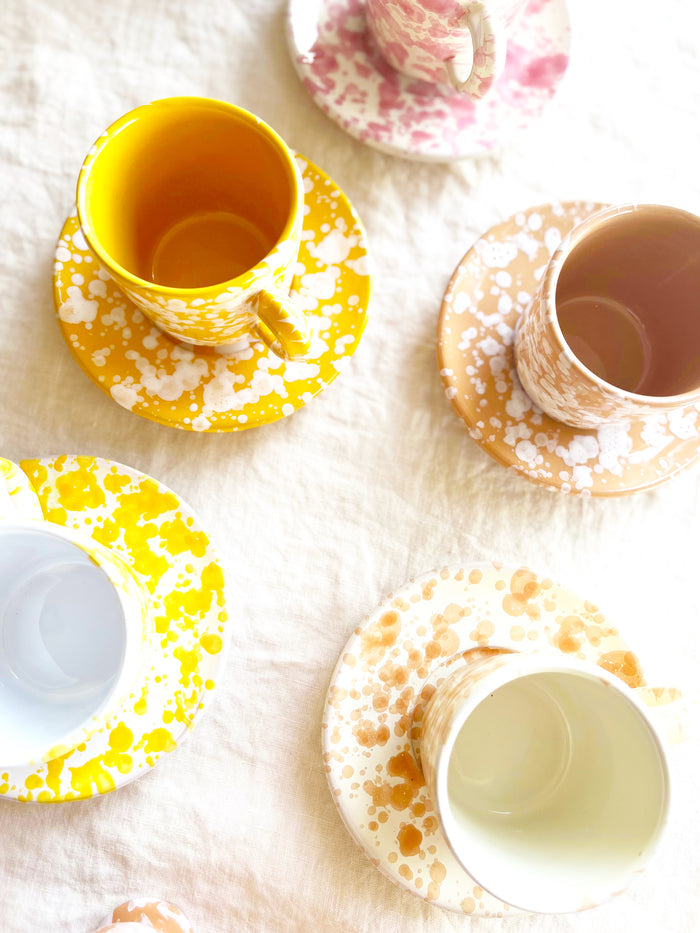 white fasano espresso cup with yellow splatter pattern top view
