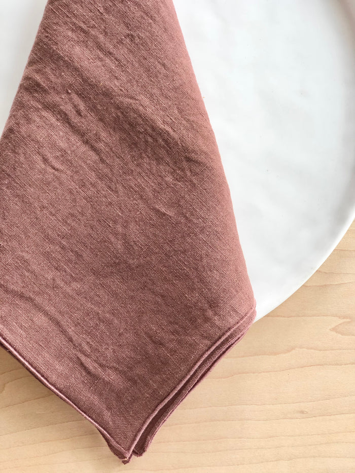 mauve linen rolled edge linen napkins with mauve edge 18 inches square edge detail view